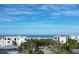 Expansive beach view from an elevated vantage point highlighting nearby luxurious residences and palm trees at 148 N Polk, Sarasota, FL 34236