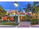 Exterior view of Columbia Restaurant, highlighting its inviting atmosphere and lush tropical surroundings at 148 N Polk, Sarasota, FL 34236