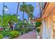 Charming street view with lush landscaping, featuring a well-maintained sidewalk and storefronts at 148 N Polk, Sarasota, FL 34236