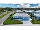 An aerial view of a community featuring well-maintained homes, lush landscaping, and coordinated architectural design at 1511 S Knollwood Dr, Bradenton, FL 34208