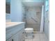 Updated bathroom with tiled shower, grab bar, and updated vanity at 1511 S Knollwood Dr, Bradenton, FL 34208
