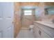 Bathroom with a remodeled walk-in shower, safety bar, new vanity, and neutral paint at 1511 S Knollwood Dr, Bradenton, FL 34208