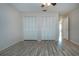 Open bedroom with two large closets, ceiling fan, wood floors, and ample natural light at 1511 S Knollwood Dr, Bradenton, FL 34208