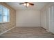 Spacious bedroom with laminated floors, a ceiling fan, window shutters, and a large closet at 1511 S Knollwood Dr, Bradenton, FL 34208