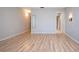 Spacious bedroom with wood-look flooring, and access to the Primary bathroom at 1511 S Knollwood Dr, Bradenton, FL 34208