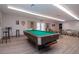 The billiard room has a pool table, tables, chairs, and a ping pong table for residents to enjoy at 1511 S Knollwood Dr, Bradenton, FL 34208