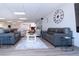 Comfortable common area featuring sofas, chairs, tables, and a large clock on the wall at 1511 S Knollwood Dr, Bradenton, FL 34208
