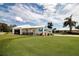 Beautiful River Club Golf Club with well-maintained landscaping, golf course, and lovely sky at 1511 S Knollwood Dr, Bradenton, FL 34208