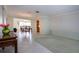 Spacious living room with a dining area, tiled floors, and views to a cozy Gathering area at 1511 S Knollwood Dr, Bradenton, FL 34208