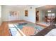 Spacious living area with laminate flooring, smooth transition to dining, kitchen and bonus room areas at 1511 S Knollwood Dr, Bradenton, FL 34208