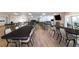 Spacious meeting room features tables, chairs, and a mounted TV for community gatherings and events at 1511 S Knollwood Dr, Bradenton, FL 34208