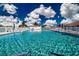 Relaxing community pool with lounge chairs to relax, sit and enjoy the beautiful weather and calming water at 1511 S Knollwood Dr, Bradenton, FL 34208