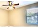 Bedroom featuring tile floors, ceiling fan and window at 15403 Leven Links Pl, Lakewood Ranch, FL 34202