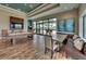 Entertaining game room with a pool table, large TV, and comfortable seating, creating a perfect space for leisure at 15403 Leven Links Pl, Lakewood Ranch, FL 34202