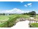 Scenic view of the golf course showcasing meticulously manicured greens and lush landscaping at 15403 Leven Links Pl, Lakewood Ranch, FL 34202