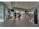 Large gym area featuring multiple cardio machines and weight training equipment, designed for a complete workout experience at 15403 Leven Links Pl, Lakewood Ranch, FL 34202