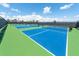 Well-maintained pickleball courts with blue and green surfaces, offering a recreational space for residents at 15403 Leven Links Pl, Lakewood Ranch, FL 34202