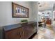 Hallway view towards an elegant dining room with modern chandelier at 16748 4Th Ne Ave, Bradenton, FL 34212