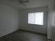 Cozy bedroom with wood-look floors and a window at 1717 Alton Rd, Port Charlotte, FL 33952