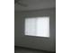 Bedroom featuring a window with blinds, allowing for natural light and privacy at 1717 Alton Rd, Port Charlotte, FL 33952