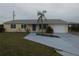 Charming one-story home with a well-maintained lawn, a palm tree and an attached garage at 1717 Alton Rd, Port Charlotte, FL 33952