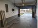 The large, open garage provides storage and direct entry to the home at 1717 Alton Rd, Port Charlotte, FL 33952