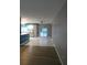 Spacious kitchen with tile floors, stainless appliances, and a view of the pool through sliding glass doors at 1717 Alton Rd, Port Charlotte, FL 33952