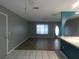 Spacious living room features tile and wood floors and a neutral color palette at 1717 Alton Rd, Port Charlotte, FL 33952