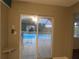View of screened-in pool from indoor patio door entrance at 1717 Alton Rd, Port Charlotte, FL 33952