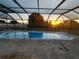 Enjoy swimming year-round in this screened-in pool with views of the lush surrounding landscape at 1717 Alton Rd, Port Charlotte, FL 33952