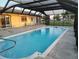 The crystal blue pool offers a relaxing and private retreat for outdoor enjoyment at 1717 Alton Rd, Port Charlotte, FL 33952