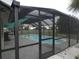 Screened-in pool offering a refreshing escape from the heat at 1717 Alton Rd, Port Charlotte, FL 33952