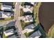 An aerial view of a single-Gathering home in a well-manicured neighborhood, located adjacent to a pond at 17703 Savory Mist Cir, Bradenton, FL 34211