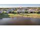 A home overlooking a serene lake in a picturesque residential neighborhood at 17703 Savory Mist Cir, Bradenton, FL 34211