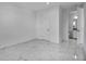 A bright bedroom featuring a large format tile floor and an ensuite bathroom at 17703 Savory Mist Cir, Bradenton, FL 34211