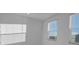 Bright bedroom with a large window offering outside views at 17703 Savory Mist Cir, Bradenton, FL 34211