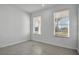 Sunlit bedroom with neutral tones, tiled floor, and large windows with scenic view at 17703 Savory Mist Cir, Bradenton, FL 34211