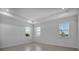 Bright bedroom with three large windows offering a view of the water at 17703 Savory Mist Cir, Bradenton, FL 34211