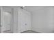 Neutral bedroom features double door closet, tiled flooring, and abundant natural light at 17703 Savory Mist Cir, Bradenton, FL 34211