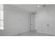A bright bedroom featuring a large format tile floor and a double door closet at 17703 Savory Mist Cir, Bradenton, FL 34211