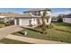 Beautiful two-story home with manicured lawn and a three-car garage at 17703 Savory Mist Cir, Bradenton, FL 34211