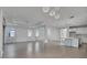 Spacious living room with tile flooring, recessed lighting, and an open concept design at 17703 Savory Mist Cir, Bradenton, FL 34211