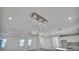 Bright living room featuring a modern light fixture and neutral decor at 17703 Savory Mist Cir, Bradenton, FL 34211