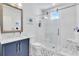 Stylish bathroom showcases a sliding glass door shower and granite vanity at 2283 Arlington St, Sarasota, FL 34239
