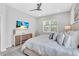 Serene bedroom with large bed, tv, and modern furniture at 2283 Arlington St, Sarasota, FL 34239