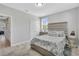 Bedroom featuring a queen bed, two doors, a window, and nautical-themed decor at 2283 Arlington St, Sarasota, FL 34239