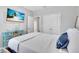 Bedroom featuring a beach themed television, natural light, and nautical decor at 2283 Arlington St, Sarasota, FL 34239