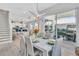Bright dining area with modern lighting fixture, sliding glass doors, and an open layout at 2283 Arlington St, Sarasota, FL 34239