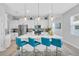 Bright kitchen with center island, modern pendant lighting, and four bar stools perfect for entertaining at 2283 Arlington St, Sarasota, FL 34239