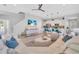 Inviting living area with open layout to kitchen, neutral tones, and coastal-inspired decor at 2283 Arlington St, Sarasota, FL 34239